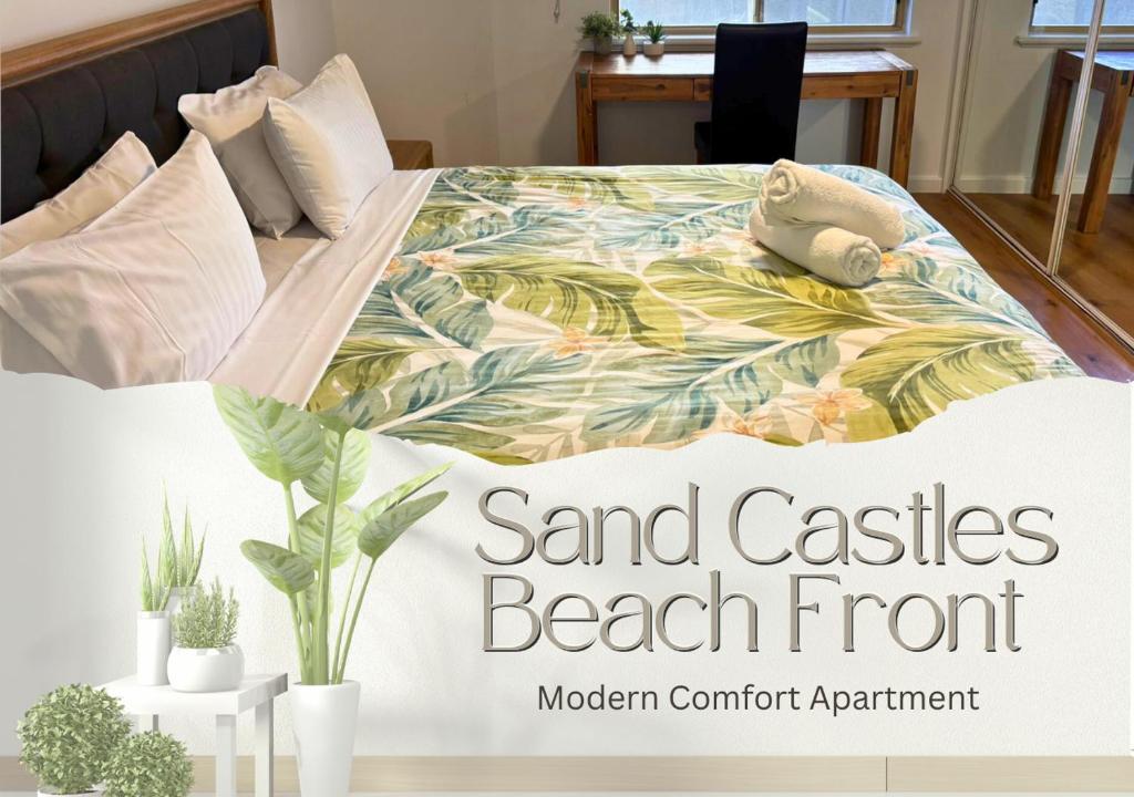 a bed in a bedroom with a beachfront at Sandcastles Beachfront Luxury Retreat Apartment in Perth
