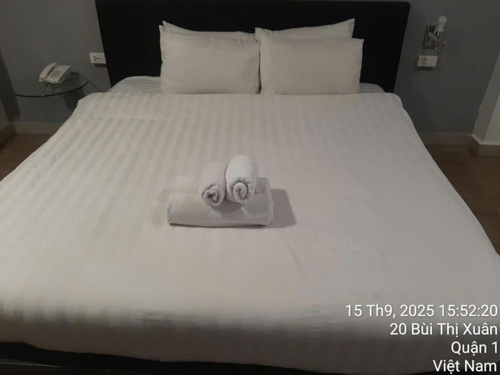 Ένα ή περισσότερα κρεβάτια σε δωμάτιο στο La Nista Hotel 1