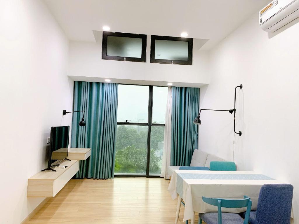 TV a/nebo společenská místnost v ubytování The Sun Avenue - Riverside Apartment