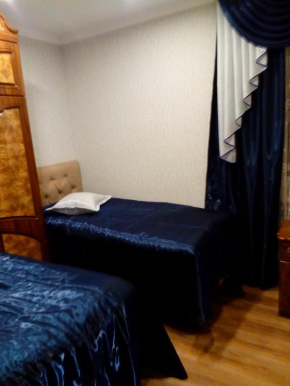 Postel nebo postele na pokoji v ubytování Jermuk