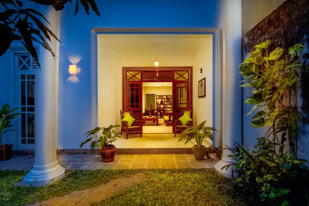 a front door of a house with plants at COLOMBO Eco Lodge & Wellness Centre in Colombo