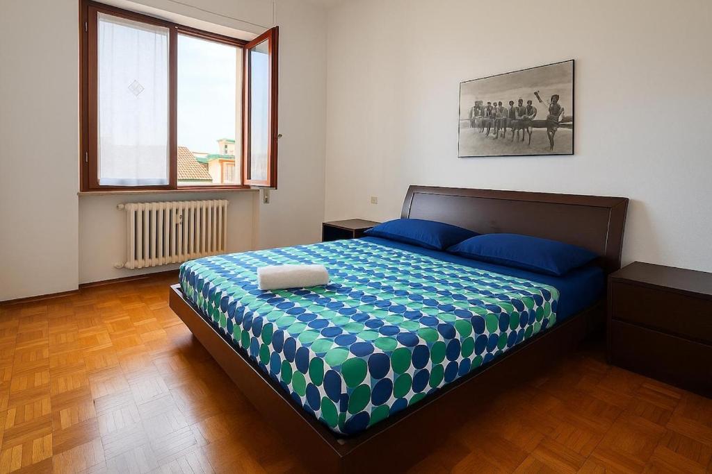 Ένα ή περισσότερα κρεβάτια σε δωμάτιο στο Comfortable apartment 5 minutes from Rho Fiera-Milano