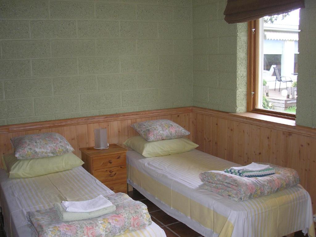 Voodi või voodid majutusasutuse Kaare Guesthouse toas