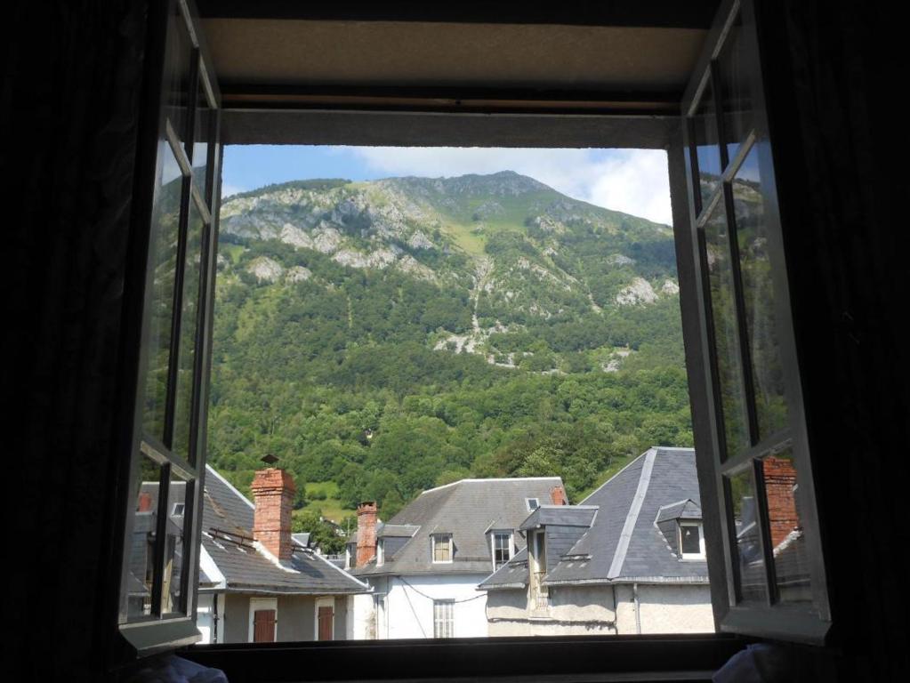 a view of a mountain from a window at Au village in Boutx