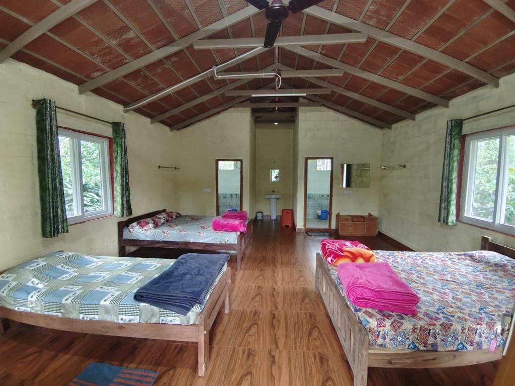 Postel nebo postele na pokoji v ubytování Prakruthi Farmstay