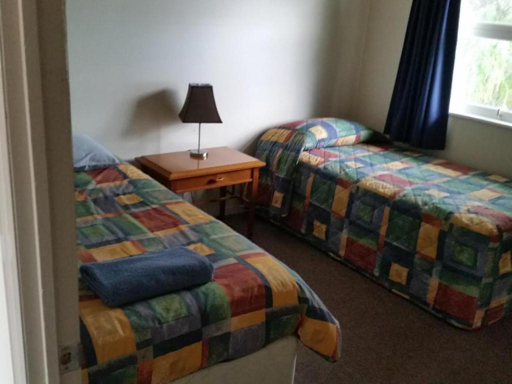 Postel nebo postele na pokoji v ubytování Augathella Palms Motel