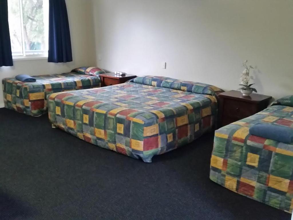 Postel nebo postele na pokoji v ubytování Augathella Palms Motel
