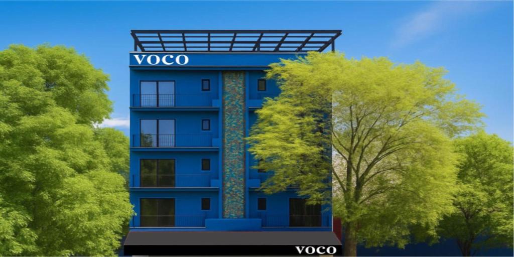 a rendering of a blue building with trees in front at voco Ciudad de Mexico Reforma by IHG in Mexico City