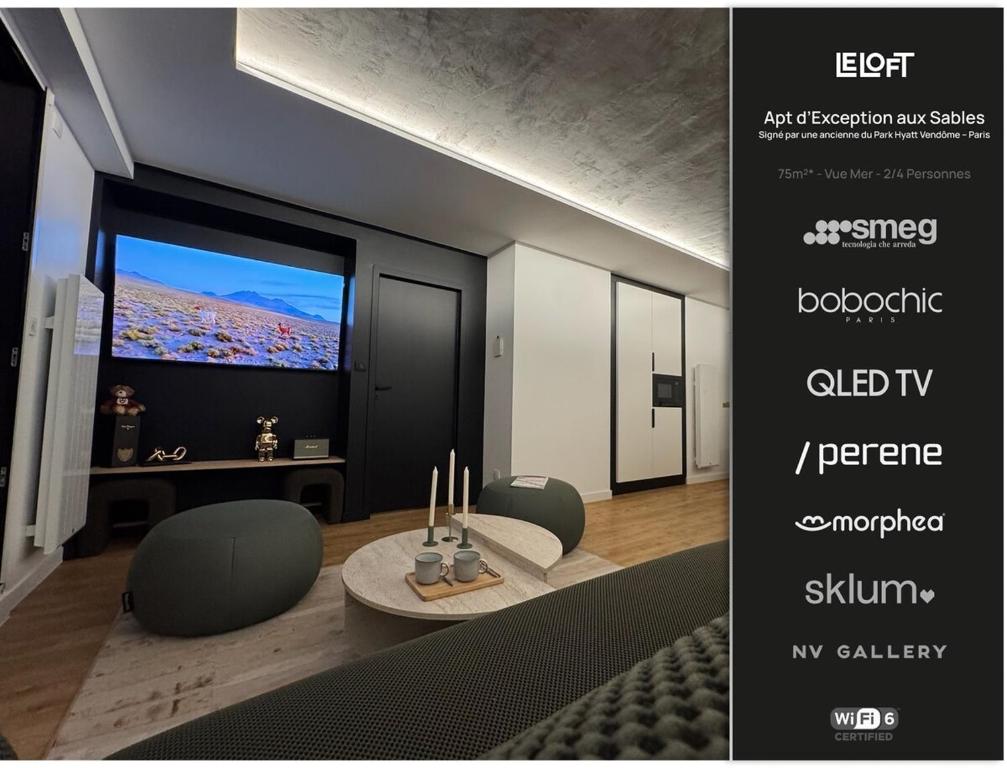 a rendering of a living room with a large screen television at Appartement d'architecte face à la mer in Les Sables-dʼOlonne
