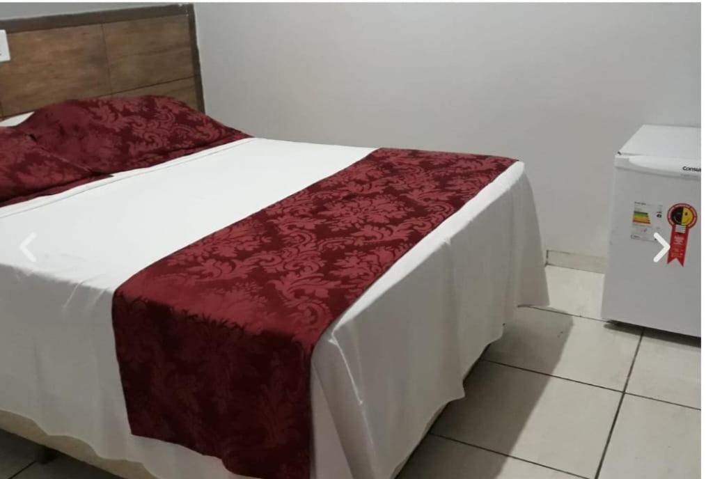Ένα ή περισσότερα κρεβάτια σε δωμάτιο στο Colorado Hotel