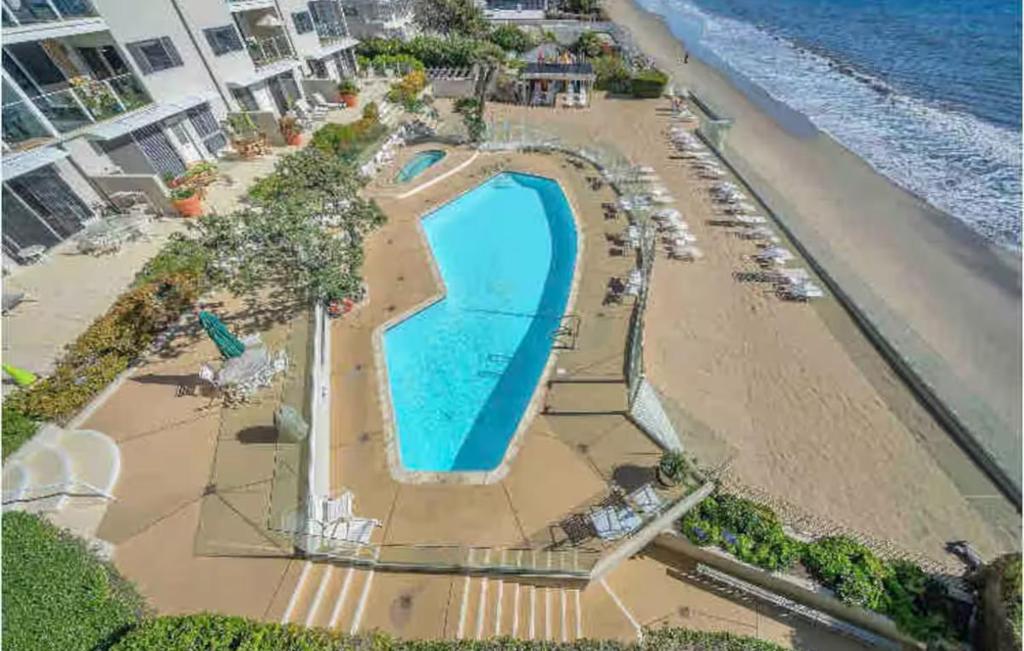 an overhead view of a swimming pool on the beach at Oceanfront, Pool, Jacuzzi NO HWY Noise! in Malibu Beach