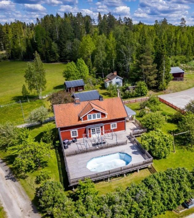 an aerial view of a house with a swimming pool at Stora Huset in Lindesberg