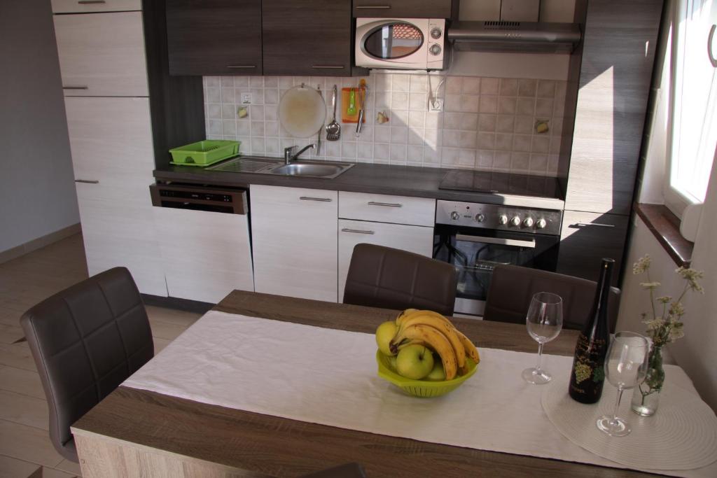 Kuchyňa alebo kuchynka v ubytovaní Apartment Pal