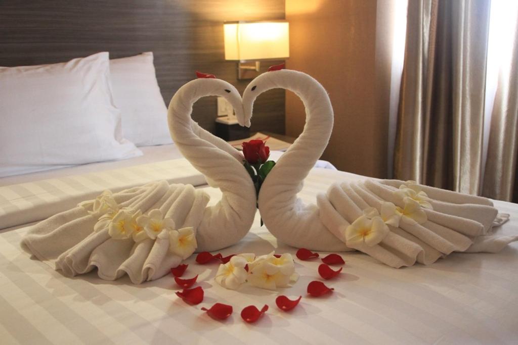 Postel nebo postele na pokoji v ubytování Biz Hotel Batam