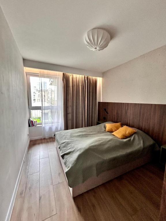 Ένα ή περισσότερα κρεβάτια σε δωμάτιο στο Apartament Targowa