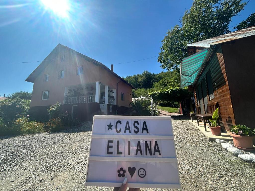 a sign that says casa elena in front of a house at Casa Eliana in Călimăneşti