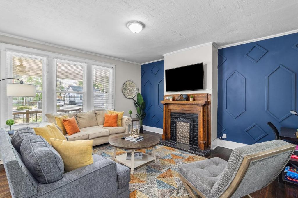 a living room with a couch and a fireplace at Master Classic-18 Mi To Augusta National Golf in Kennelworth