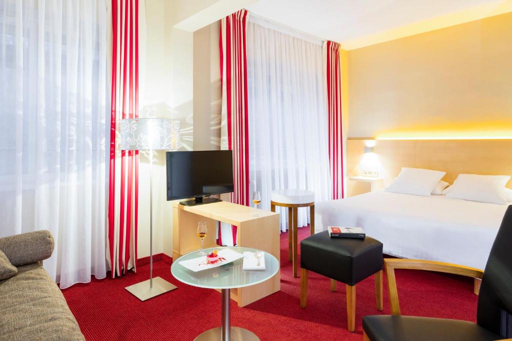 Postel nebo postele na pokoji v ubytování Hôtel Restaurant Logis Auberge Sundgovienne