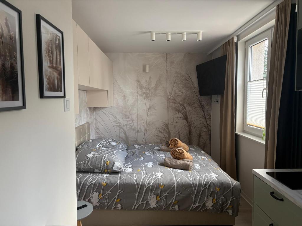 Postel nebo postele na pokoji v ubytování Apartament K&M w Lubniewicach