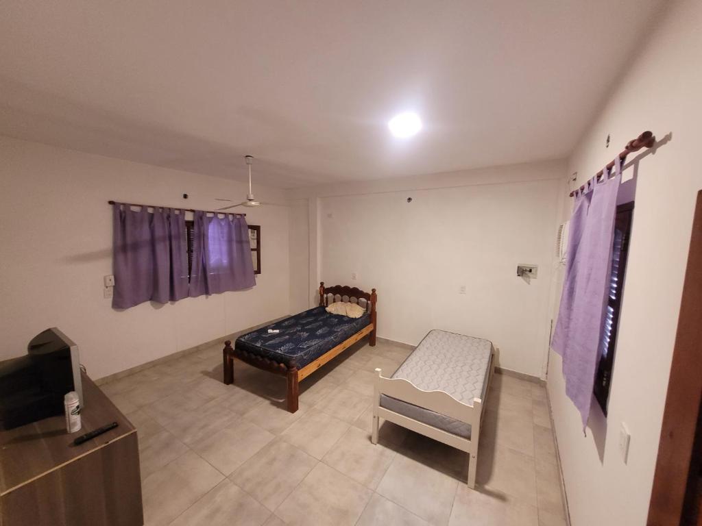 Ένα ή περισσότερα κρεβάτια σε δωμάτιο στο Departamento