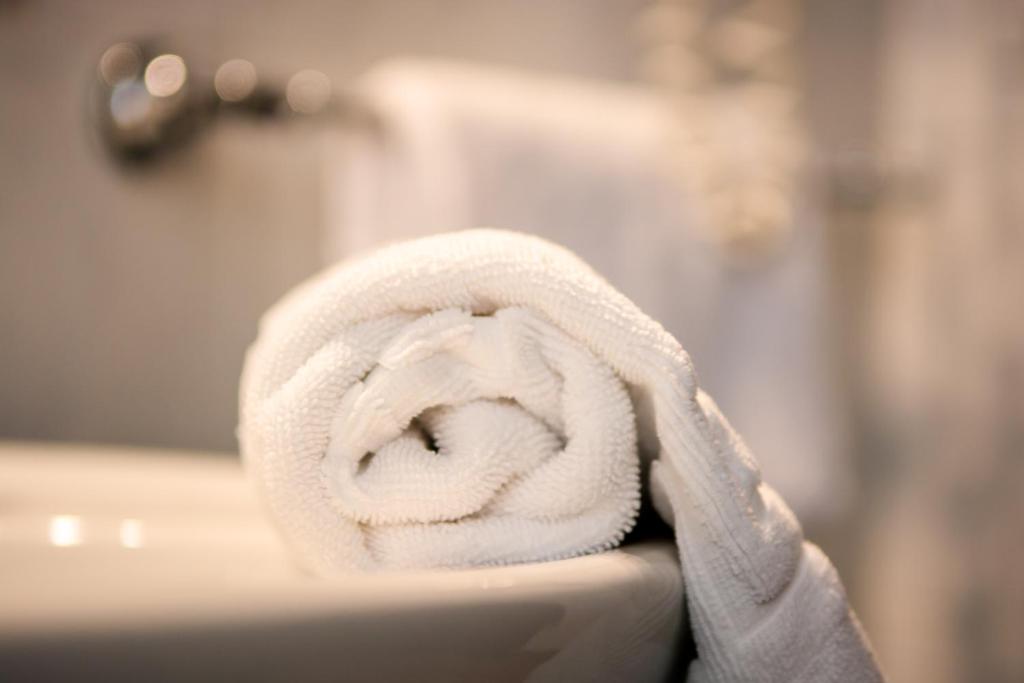 Postel nebo postele na pokoji v ubytování Hotel della Vittoria