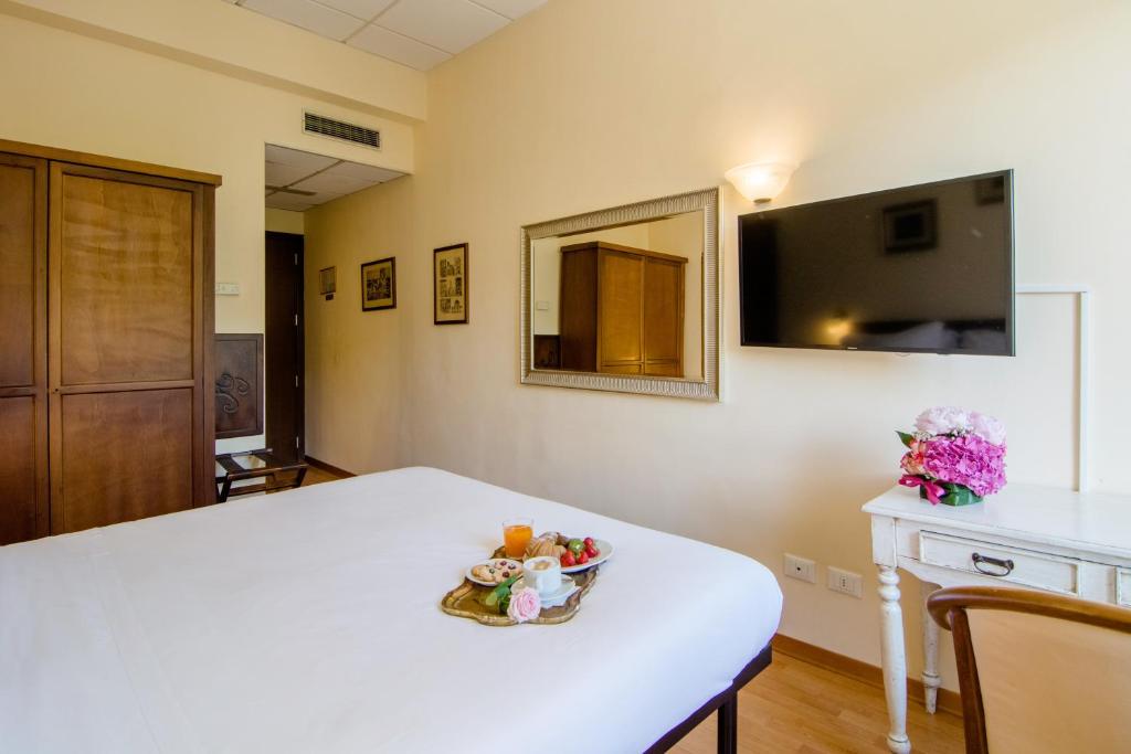 TV a/nebo společenská místnost v ubytování Hotel della Vittoria