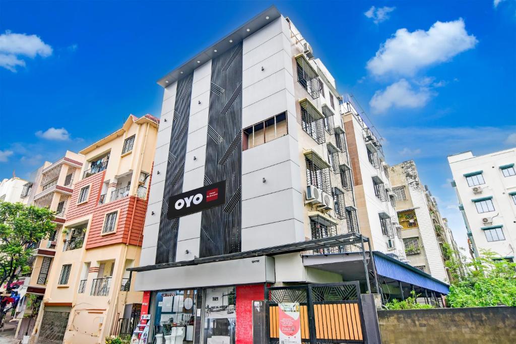 a building with a sign on the side of it at Hotel O R JOHNSON in New Town