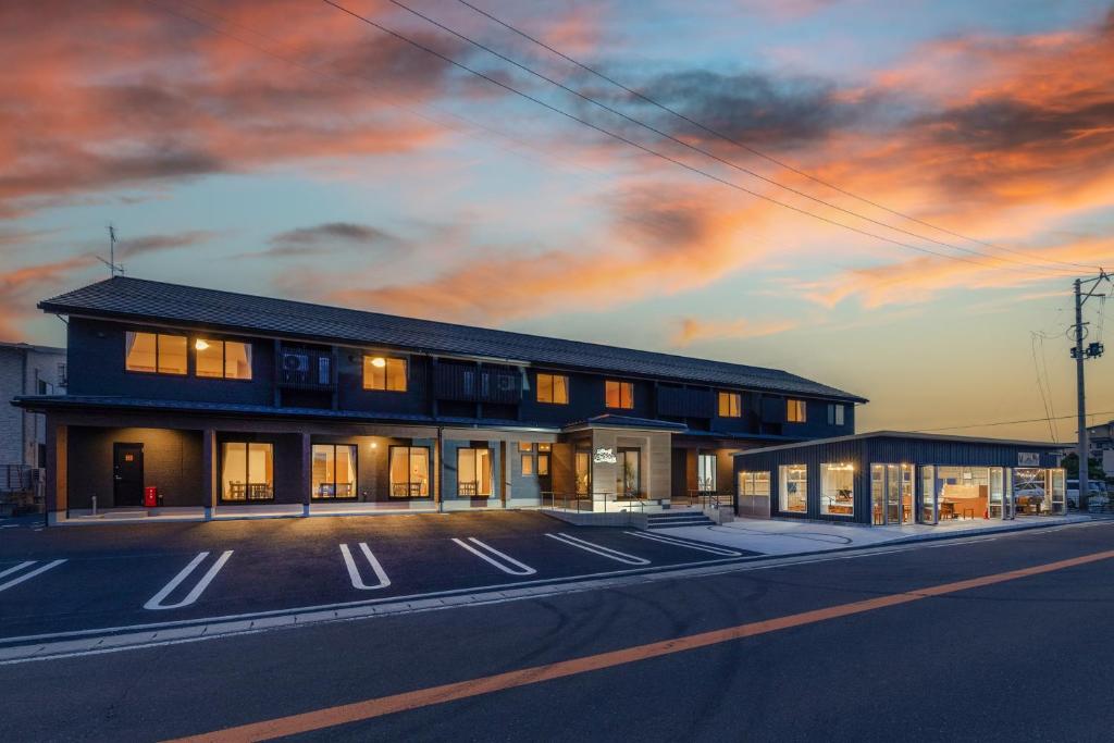 a building on the side of a street at 遊学の宿いさみや 