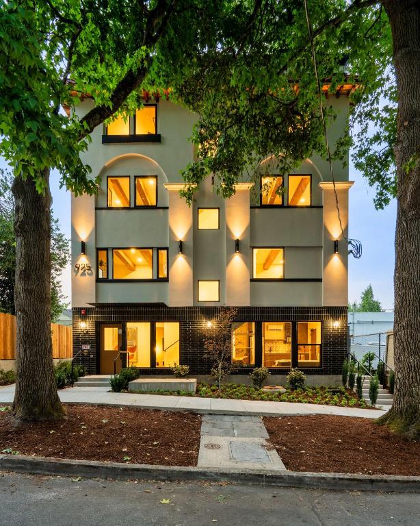 a building with lights on the side of it at Adelynn Studio Walkable Kerns Spanish Charm in Portland