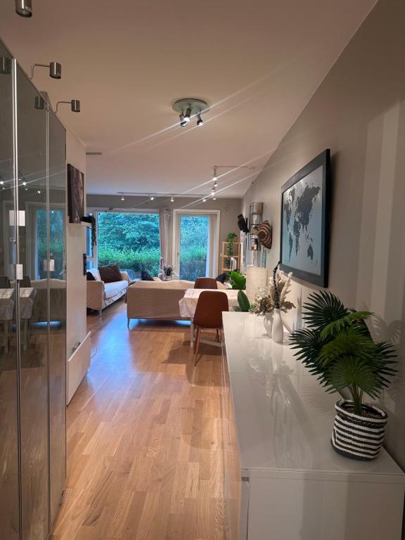 a living room with a couch and a table at Koselig leilighet i smeaheia in Sandnes