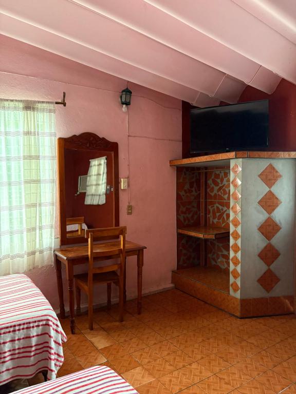 Una cama o camas en una habitación de Hotel Sabrina
