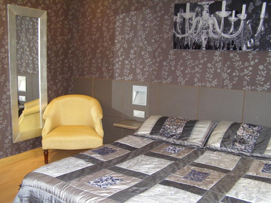 Postel nebo postele na pokoji v ubytování Hotel Area Serrano