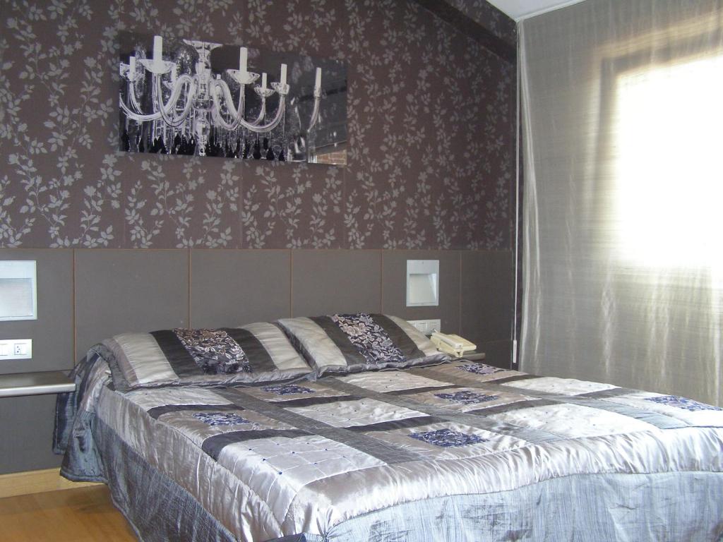 Postel nebo postele na pokoji v ubytování Hotel Area Serrano