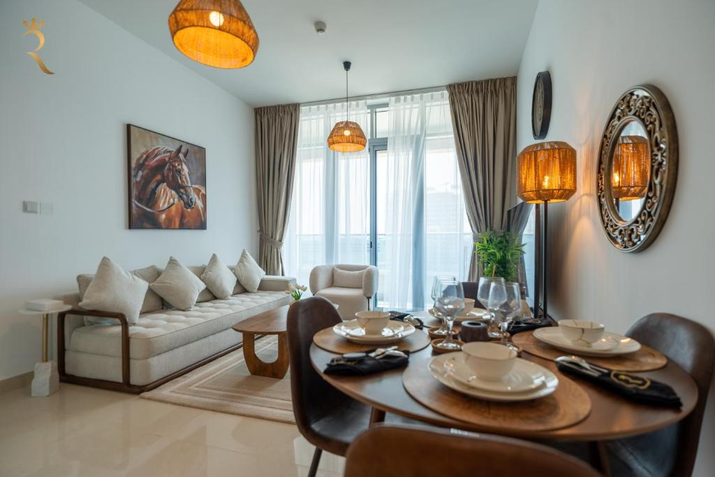 a living room with a table and a couch at Al Reem Island Pearl 1BR Retreat in Abu Dhabi