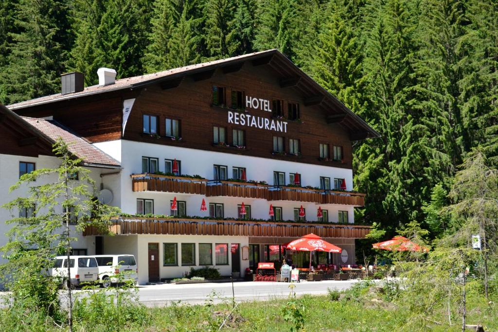 a hotel with a sign that reads hotel restaurant at Hotel Styrolerhof in Steeg