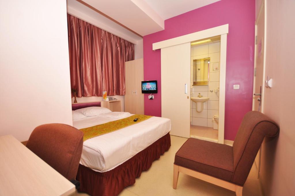 Postel nebo postele na pokoji v ubytování Han Hotel