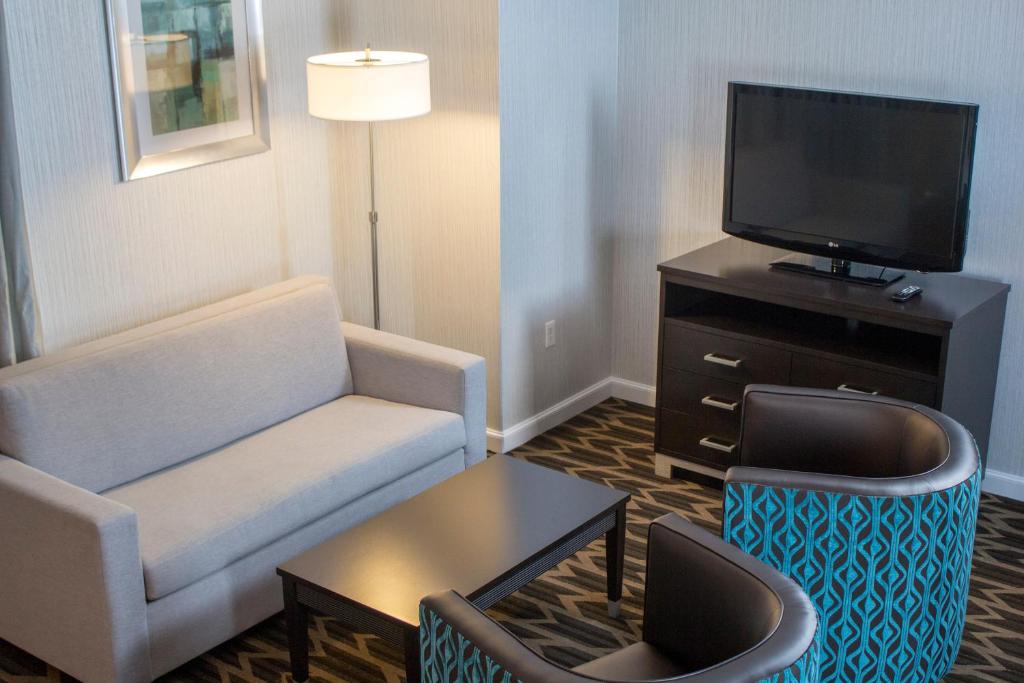 a living room with a couch and a tv at Gold Country Casino Resort in Oroville