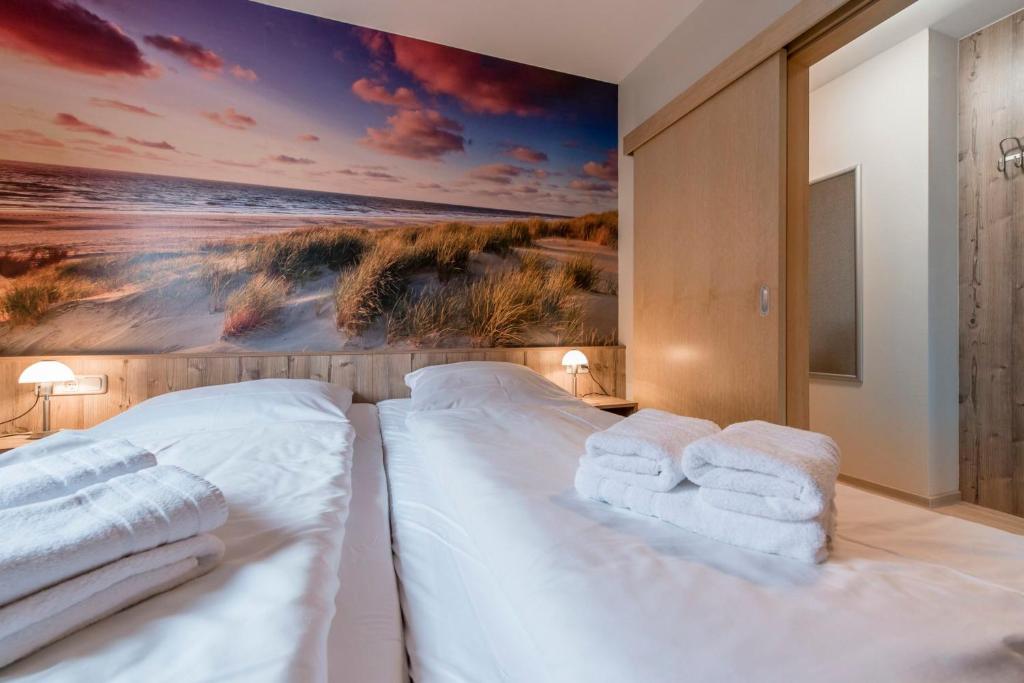 Postel nebo postele na pokoji v ubytování Pamir - 28