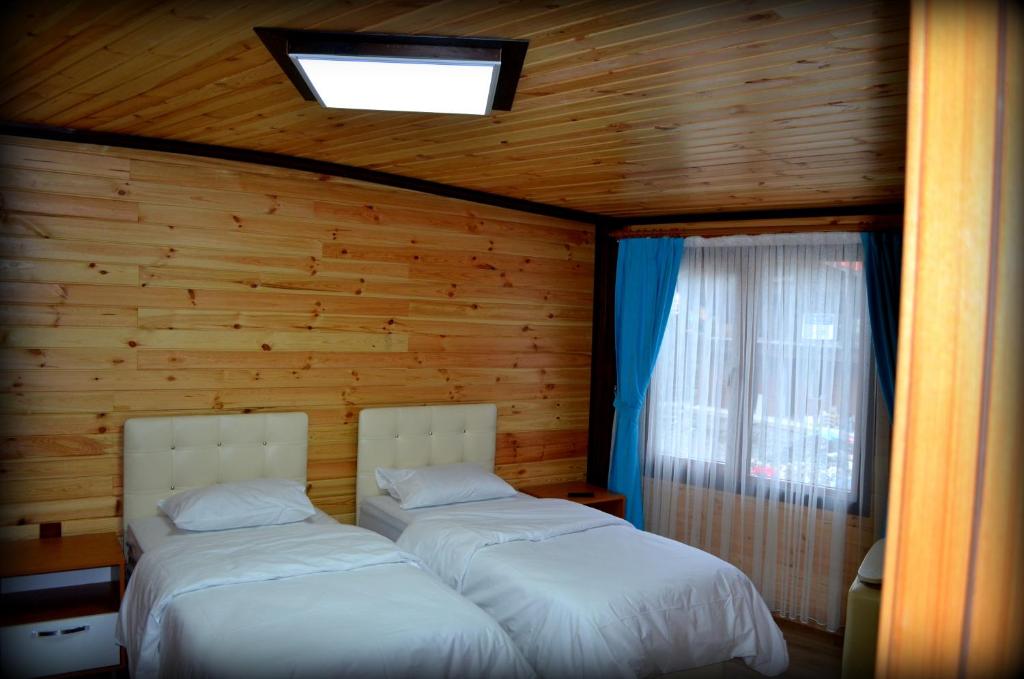 Postel nebo postele na pokoji v ubytování Osmanlı Suite