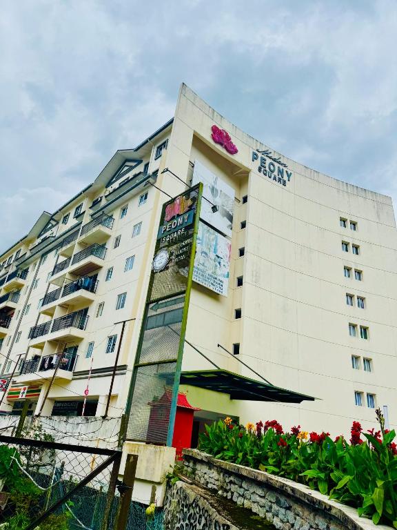 a large white building with a sign on it at Rich field Cameron Highlands Homestay-Peony Square-3BDR 2BTH-8PAX in Cameron Highlands