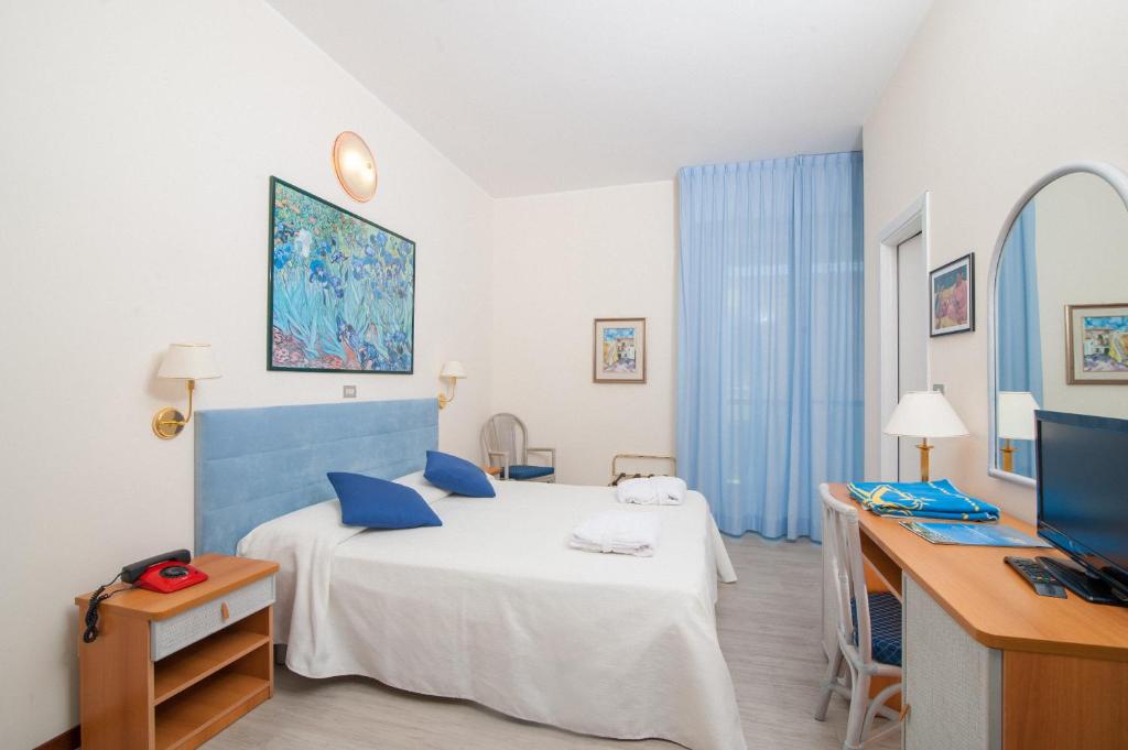 Postel nebo postele na pokoji v ubytování Hotel Majestic
