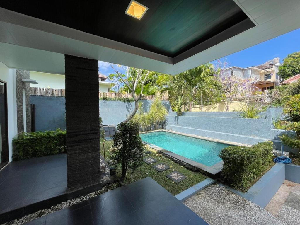an image of a swimming pool in a house at Villa Sahadewa Pecatu in Uluwatu