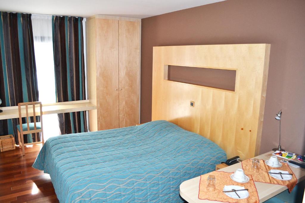 Postel nebo postele na pokoji v ubytování Hôtel la Scala