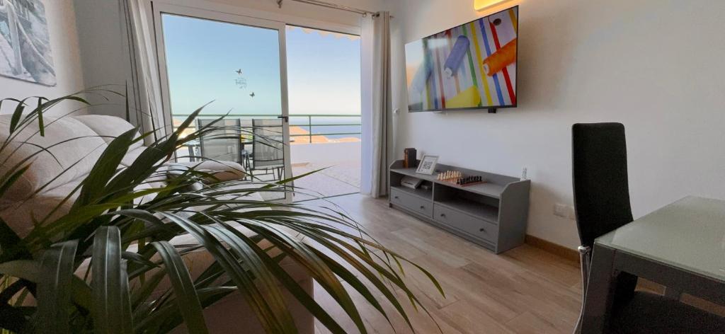 TV a/nebo společenská místnost v ubytování Apartamento Vista Atlántico Puerto Rico