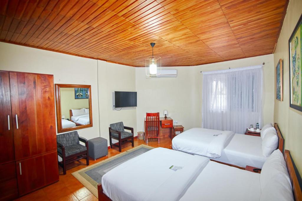 Postel nebo postele na pokoji v ubytování The Haven Boutique Hotel