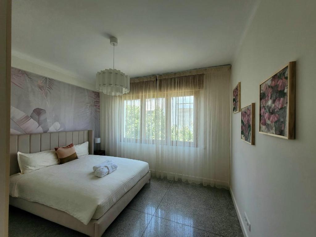 Ένα ή περισσότερα κρεβάτια σε δωμάτιο στο Immeuble du Mausolée