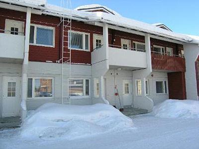a building with a lot of snow in front of it at Moonlight 309 Visit Levi in Levi