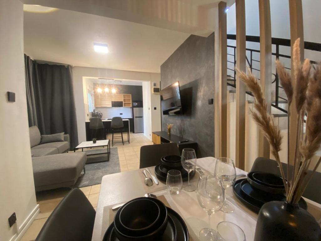 a dining room with a table and a living room at Le Dauphin Villa 3 Bedroom 5min Walk to Beach - LB2 in Flic-en-Flac