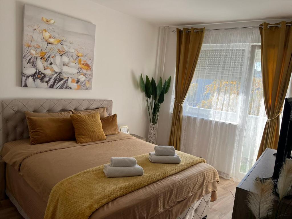 Una cama o camas en una habitación de Oaza Apartman stan na dan