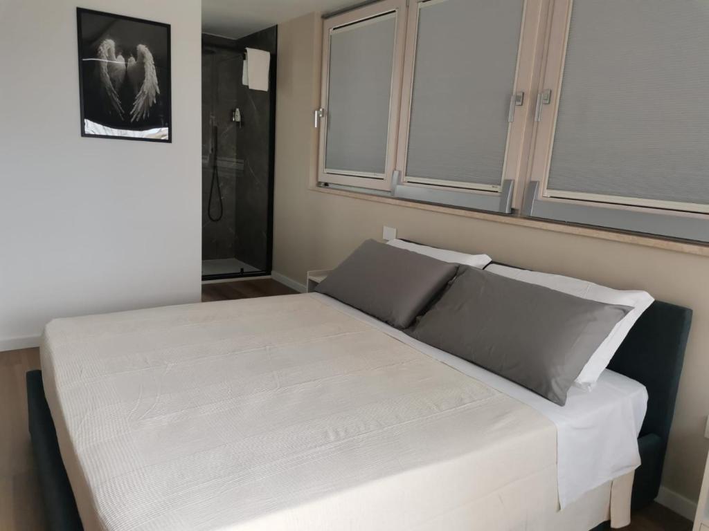 Ένα ή περισσότερα κρεβάτια σε δωμάτιο στο CIVICO 51 Luxury Apartment